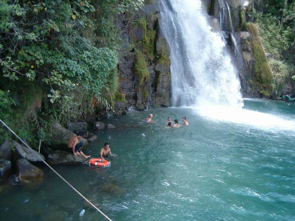 Swimming at Binangalom waterfall that plunges right into Lake Toba